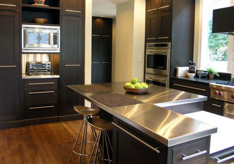 black cabinets with stainless steel countertops|kitchen with black marble countertops.